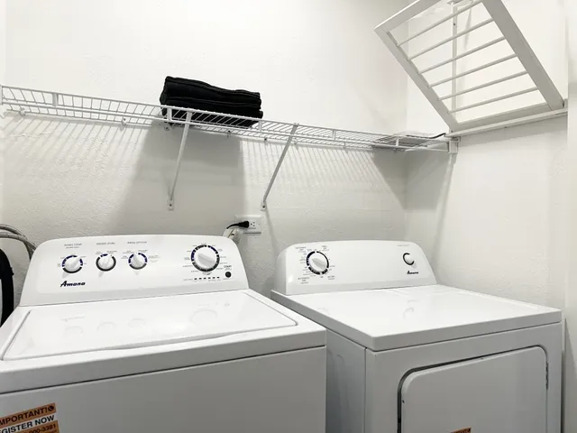a utility room with dryer and washer