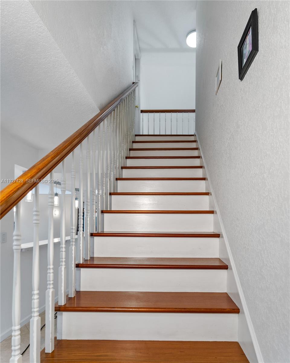 2305 St Andrews Road, Unit 129 Hollywood, FL 33021 - Photo 12 of 25 Stairs with wood flooring