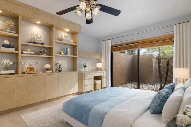 a bedroom with a large bed and a window