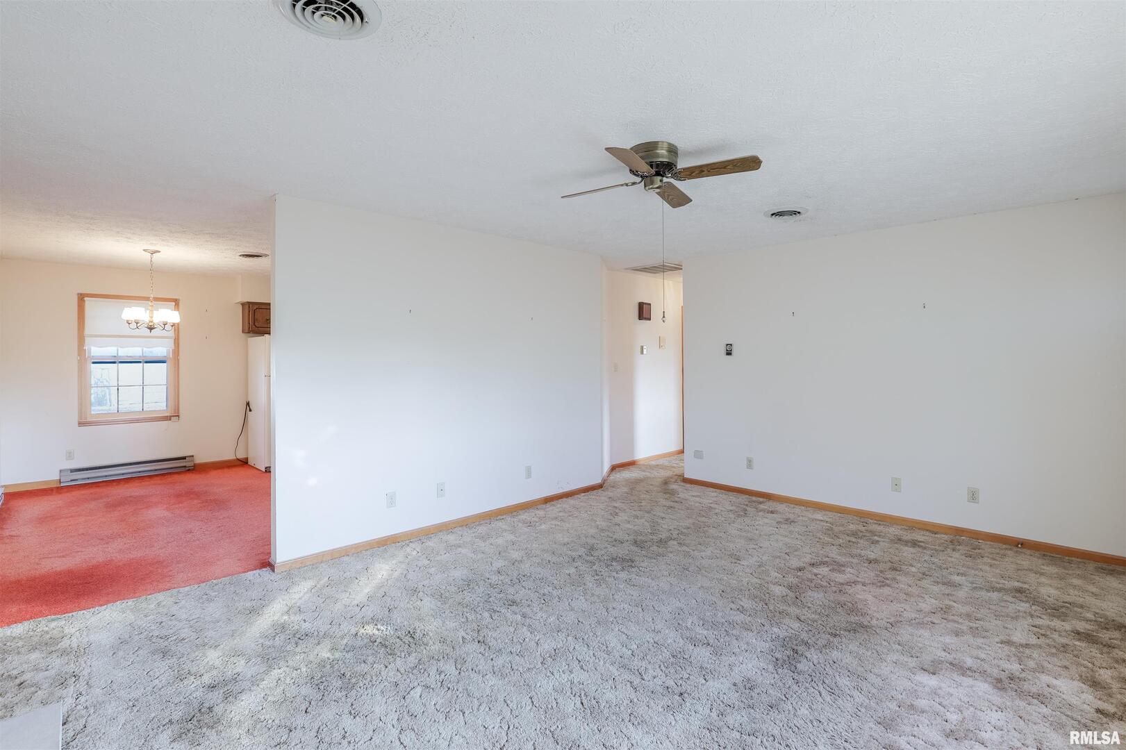 15546 Pittsburg Road Pittsburg, IL 62974 - Photo 11 of 48 an empty room with windows and closet