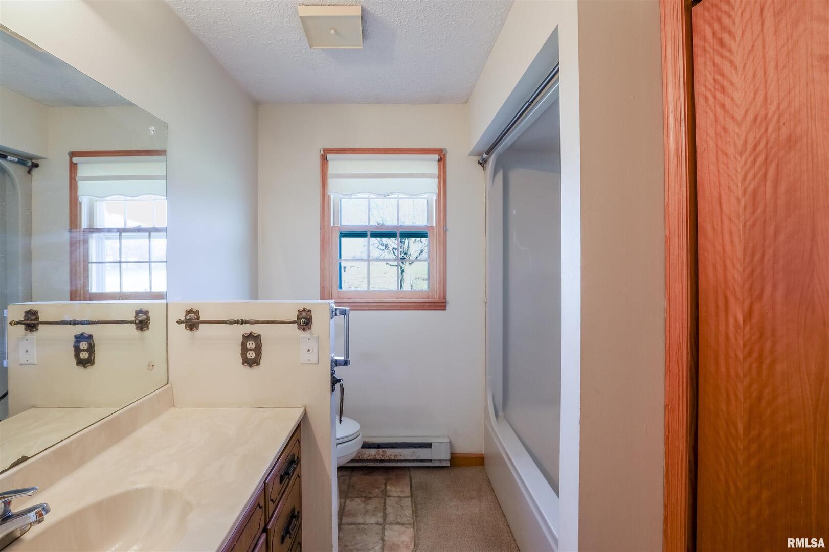15546 Pittsburg Road Pittsburg, IL 62974 - Photo 15 of 48 a bathroom with a sink and a mirror