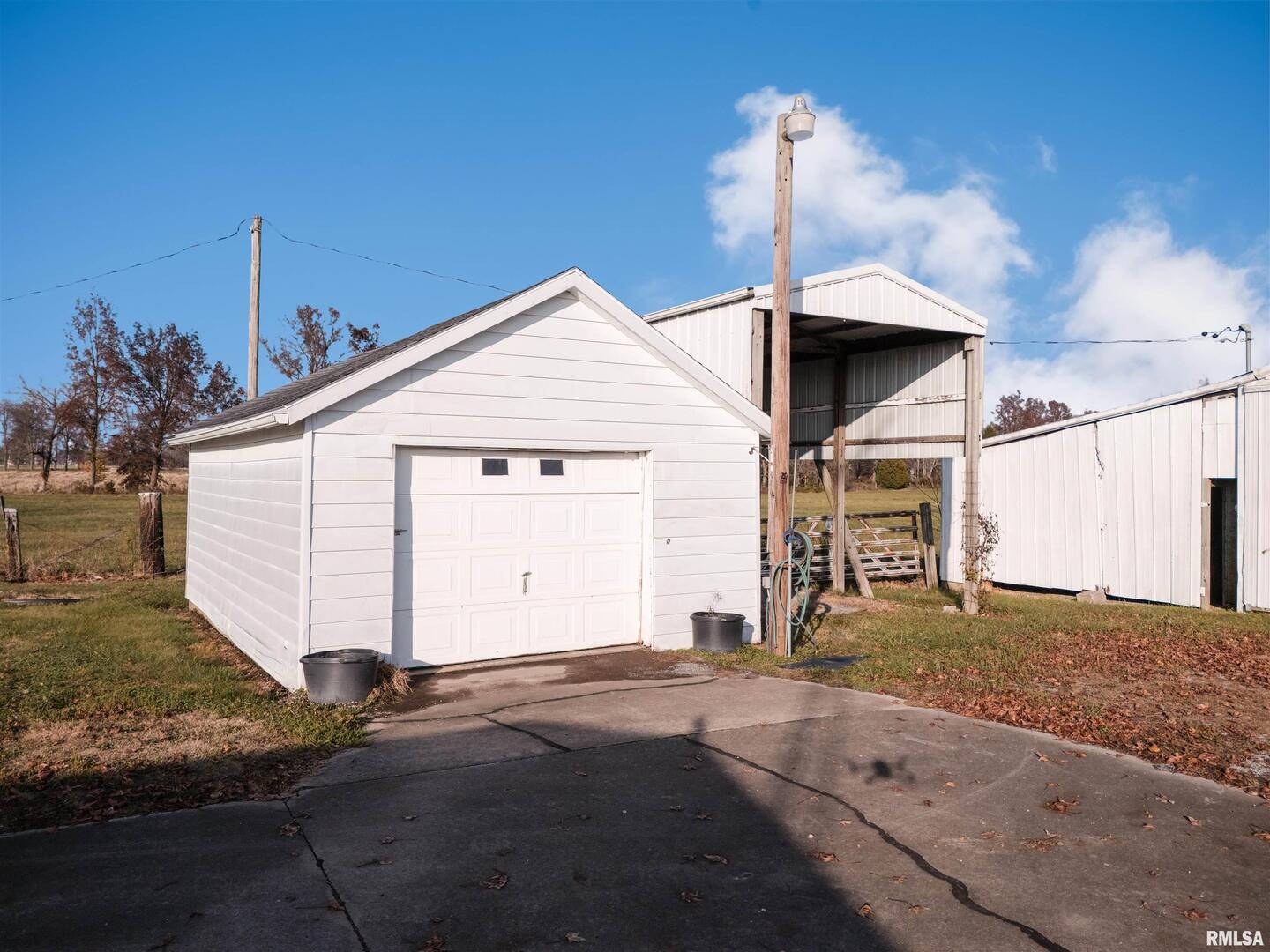 15546 Pittsburg Road Pittsburg, IL 62974 - Photo 26 of 48 a view of a house with a yard and garage