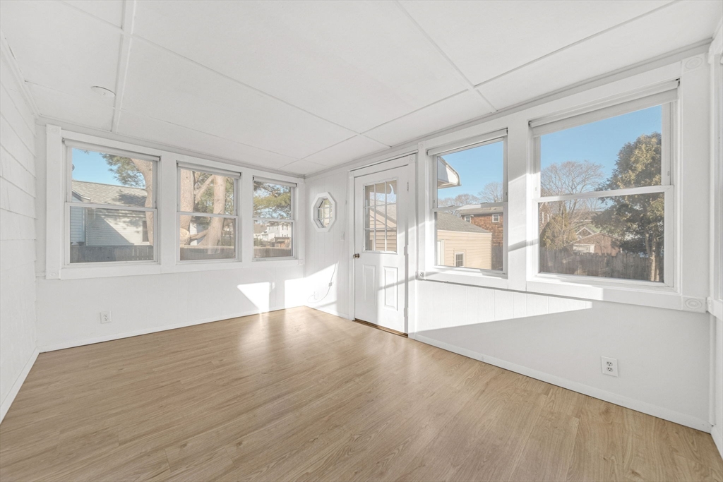 38 Longview Way Peabody, MA 01960 - Photo 13 of 42 a view of an empty room with a window and wooden floor