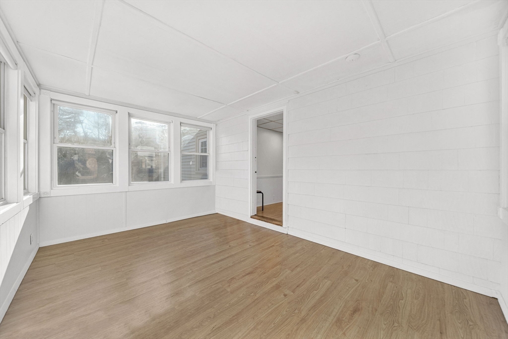 38 Longview Way Peabody, MA 01960 - Photo 14 of 42 an empty room with wooden floor and windows