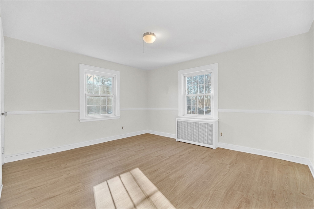38 Longview Way Peabody, MA 01960 - Photo 17 of 42 an empty room with wooden floor and windows