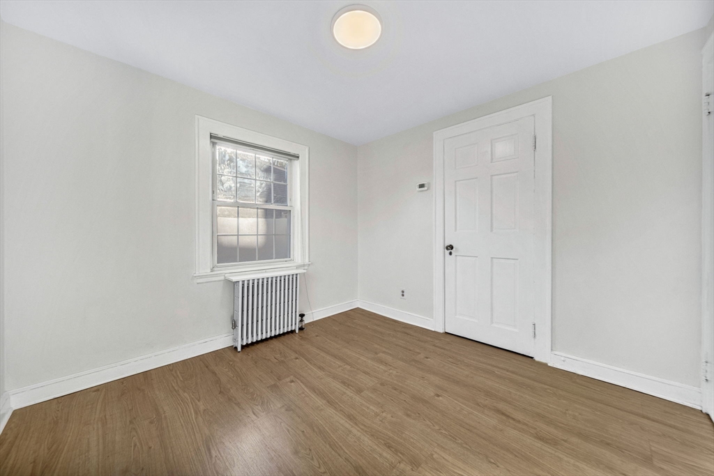 38 Longview Way Peabody, MA 01960 - Photo 18 of 42 an empty room with wooden floor and windows