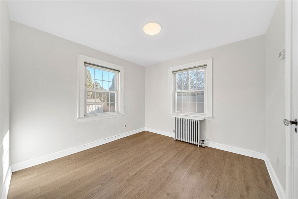 38 Longview Way Peabody, MA 01960 - Photo 20 of 42 an empty room with wooden floor and windows