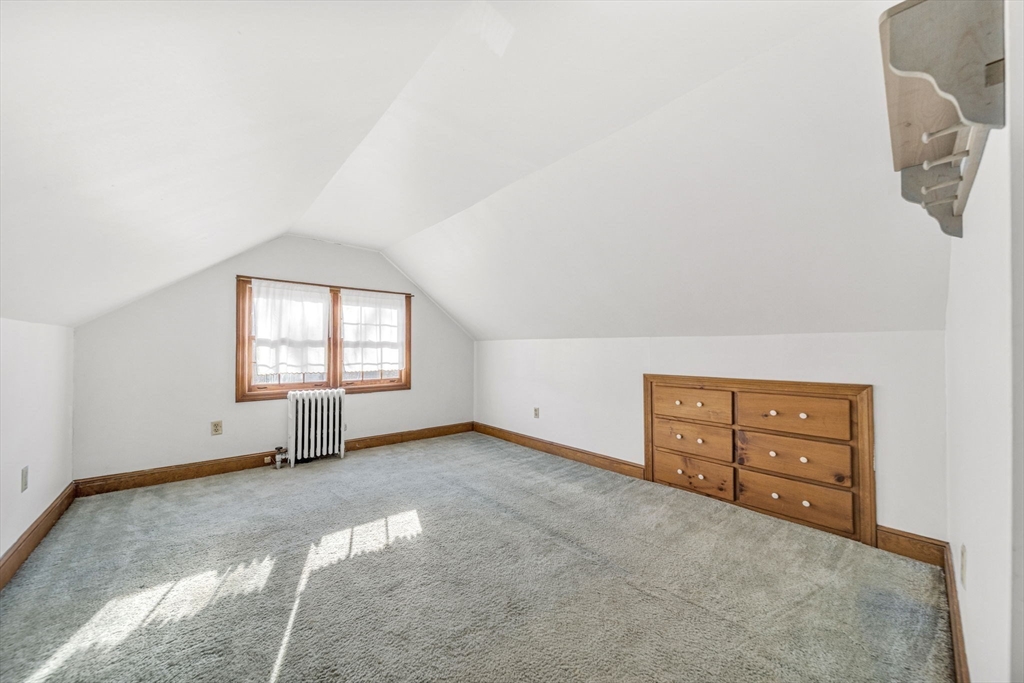 38 Longview Way Peabody, MA 01960 - Photo 22 of 42 an empty room with windows and cabinet