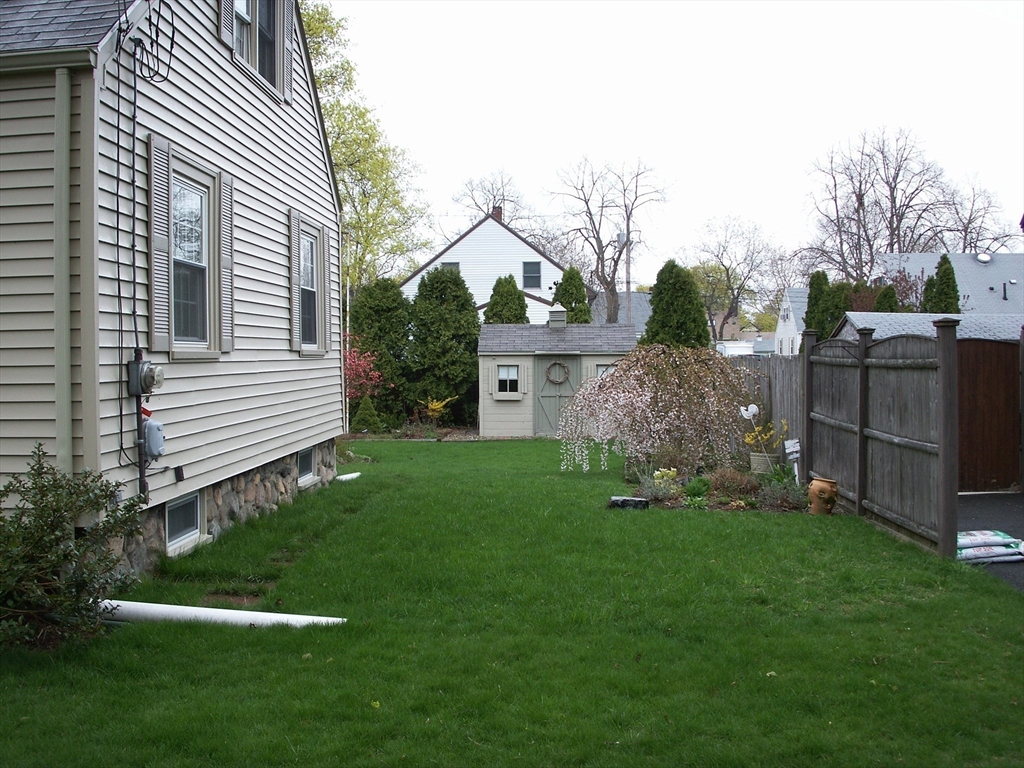 38 Longview Way Peabody, MA 01960 - Photo 25 of 42 a view of a backyard with plants and a large tree