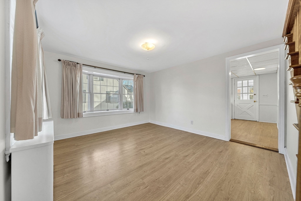 38 Longview Way Peabody, MA 01960 - Photo 10 of 42 an empty room with wooden floor and windows