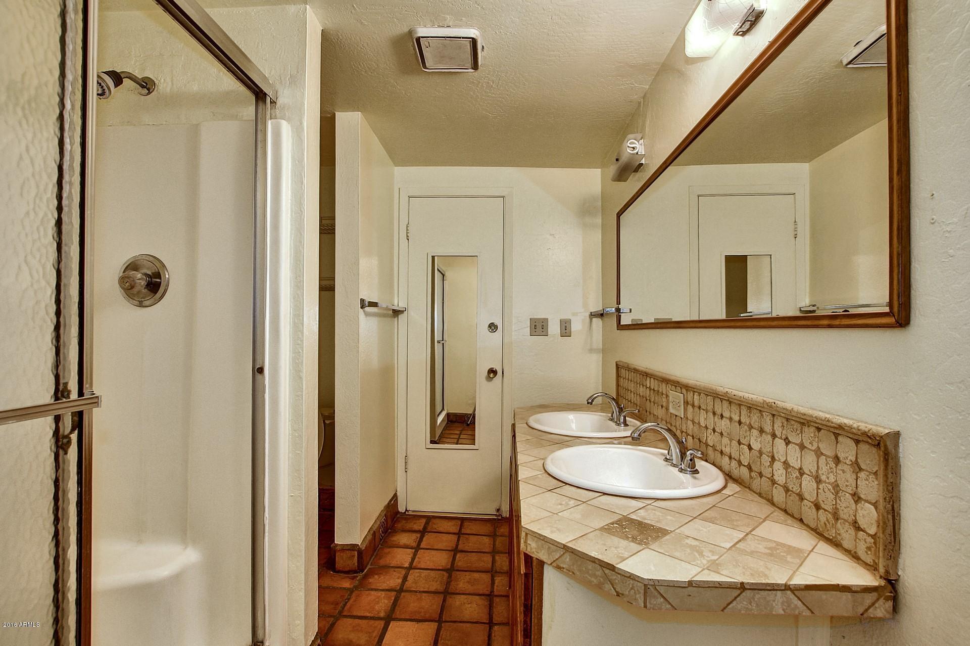 330 East 14th Street Tempe, AZ 85281 - Photo 13 of 26 a bathroom with a sink and a mirror