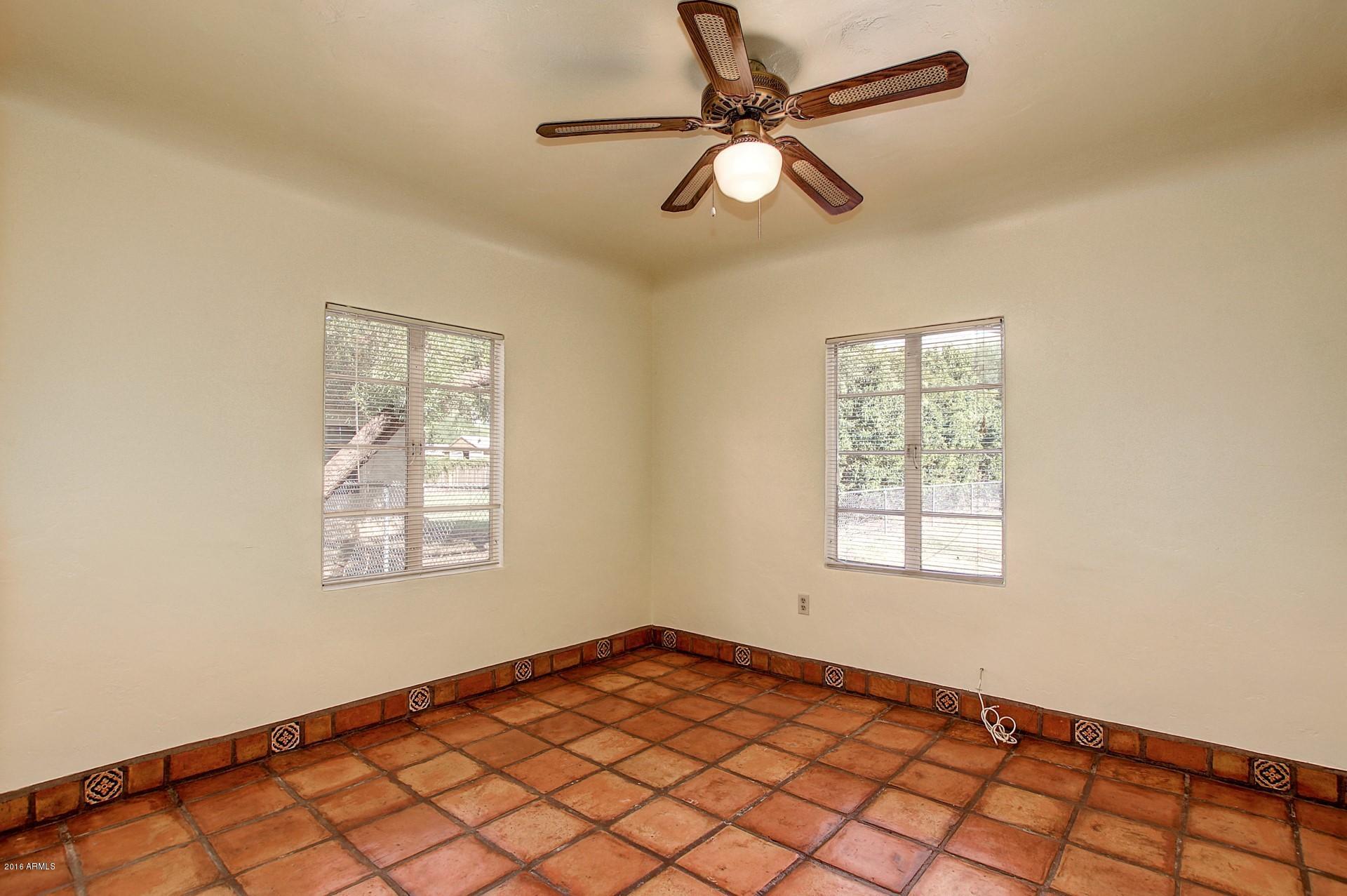 330 East 14th Street Tempe, AZ 85281 - Photo 16 of 26 an empty room with windows and fan
