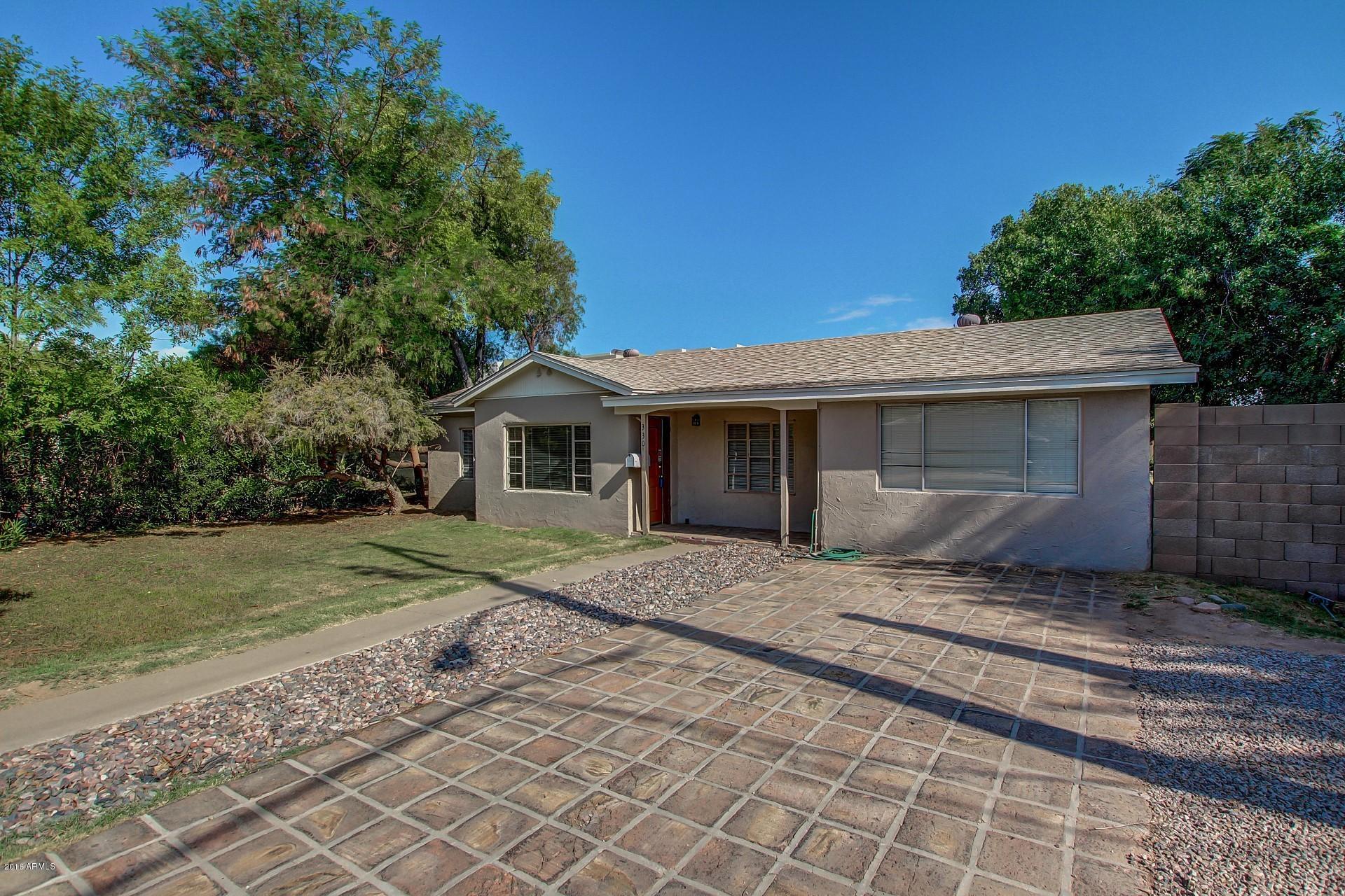 330 East 14th Street Tempe, AZ 85281 - Photo 24 of 26 a front view of a house with a yard