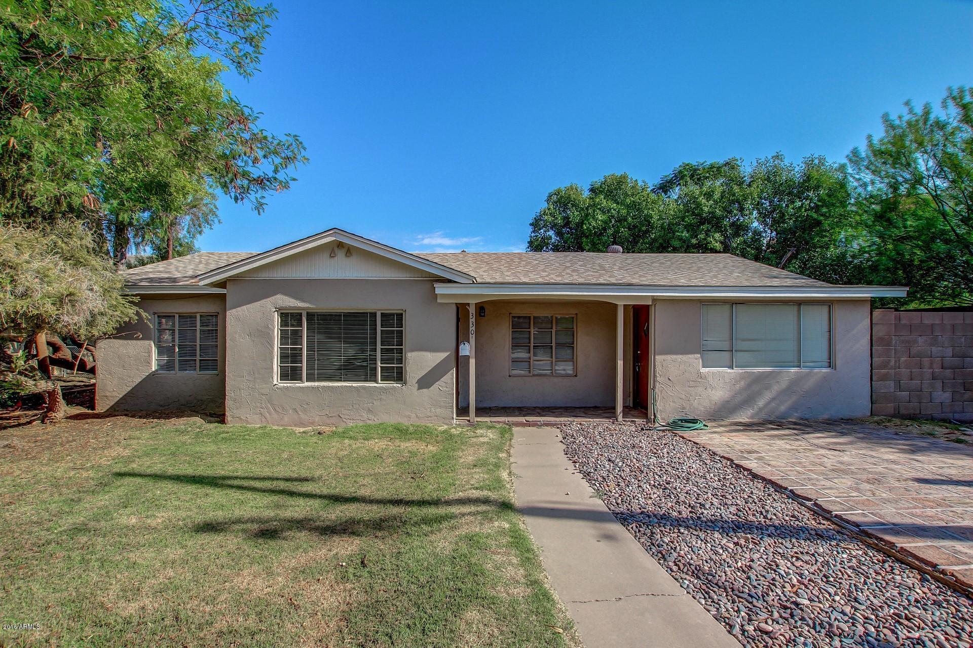 330 East 14th Street Tempe, AZ 85281 - Photo 25 of 26 a front view of a house with a garden