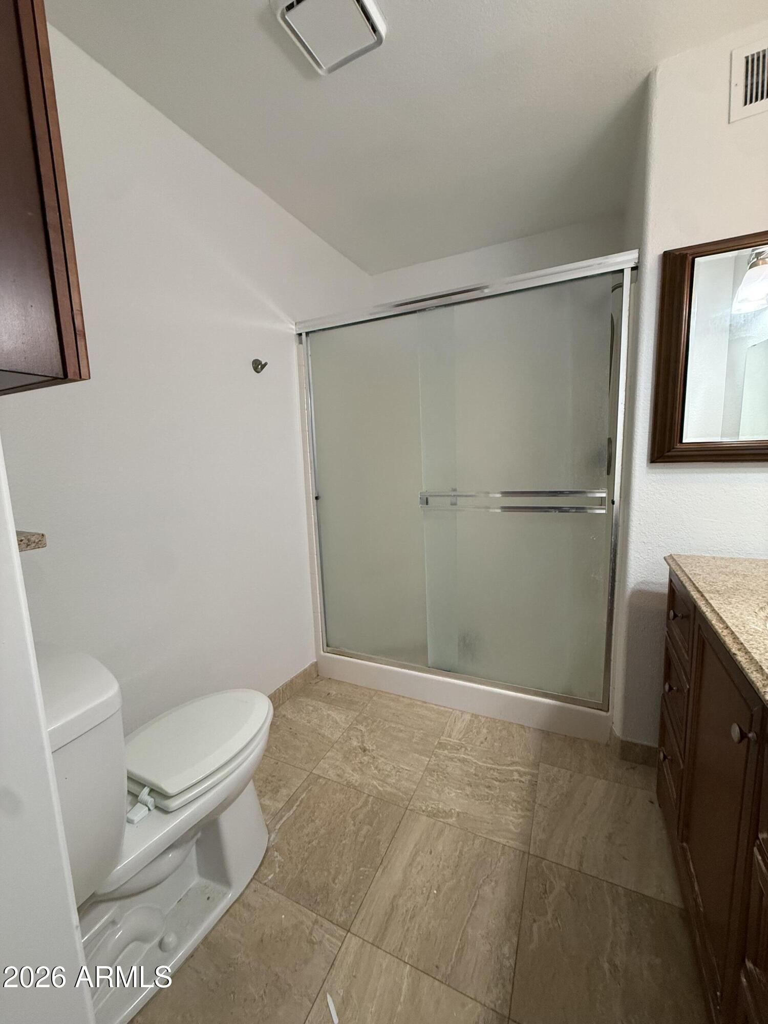 255 South Kyrene Road, Unit 140 Chandler, AZ 85226 - Photo 11 of 13 a bathroom with a toilet and a shower
