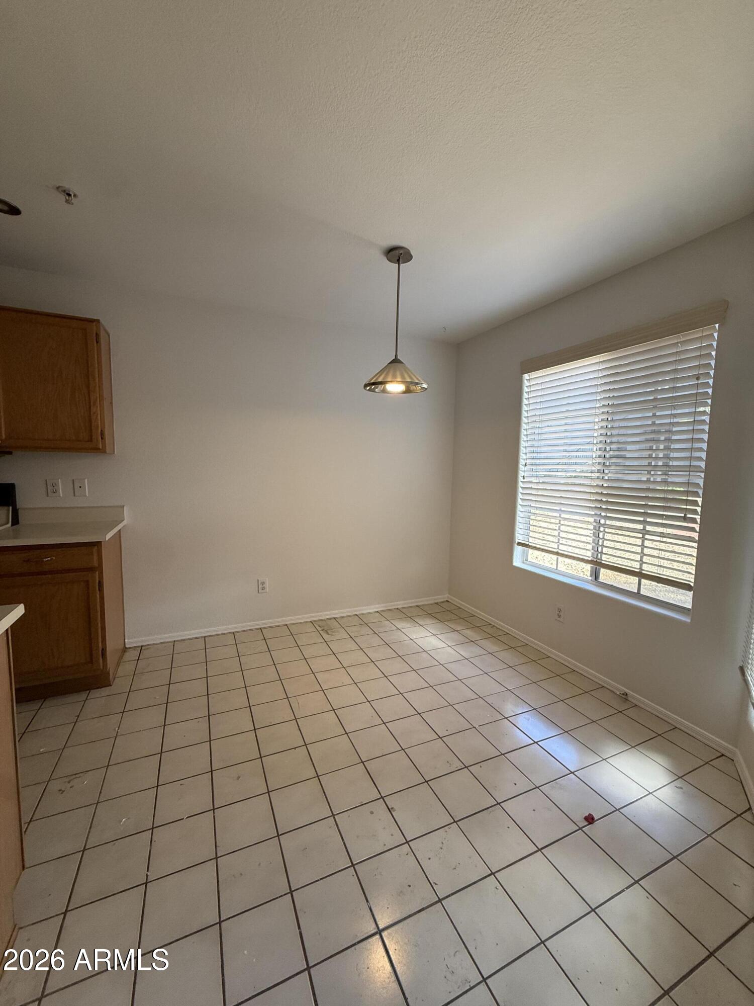 255 South Kyrene Road, Unit 140 Chandler, AZ 85226 - Photo 5 of 13 a view of an empty room and window