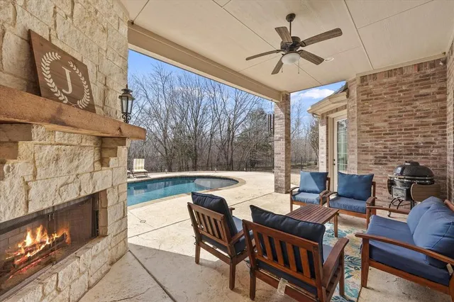 a view of a patio with a table and chairs
