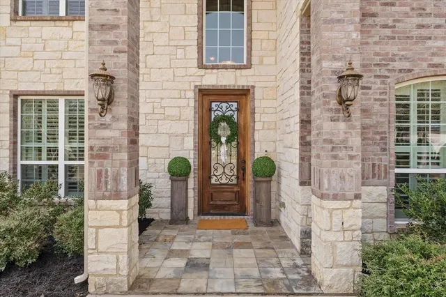 a front view of a building with a potted plant