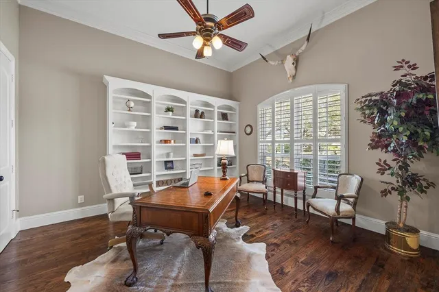a workspace with furniture window and wooden floor