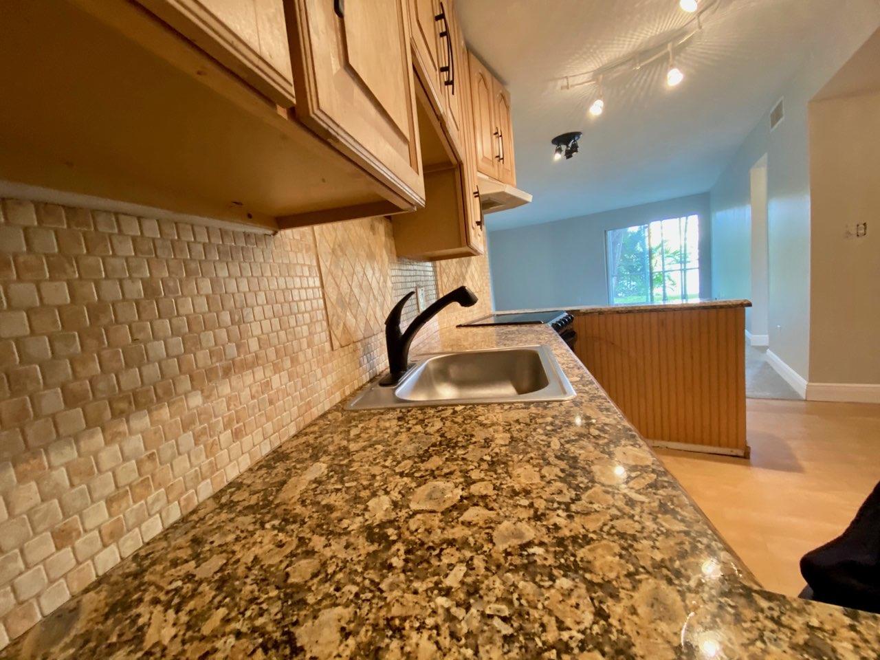 4121 Stirling Road, Unit 105 Dania Beach, FL 33314 - Photo 3 of 6 oaks kitchen 2