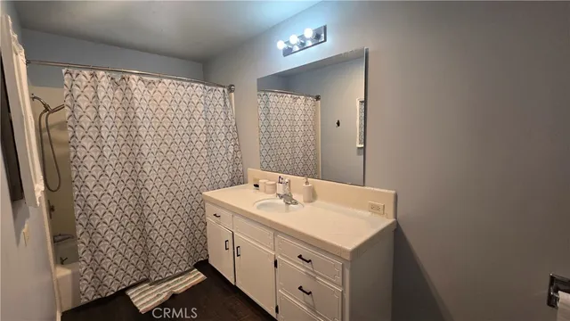 a bathroom with a sink a vanity and a mirror