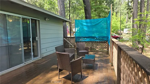 a backyard of a house with outdoor seating