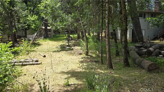 a backyard of a house with lots of green space