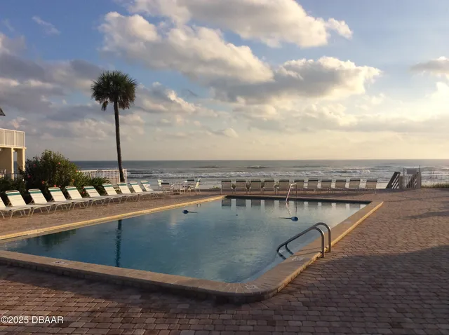 a view of a swimming pool with a terrace