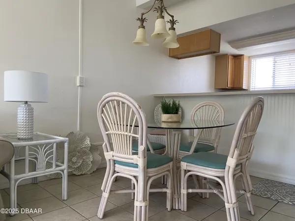 a kitchen with a stove and white cabinets