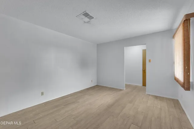 a view of a hallway with closet area