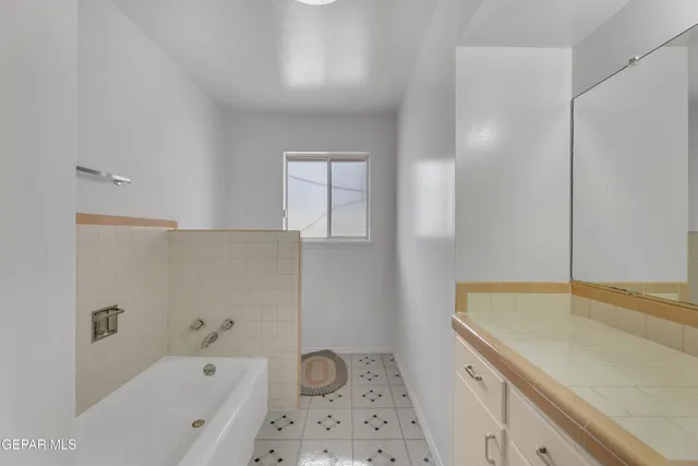 a white bath tub sitting in a bathroom