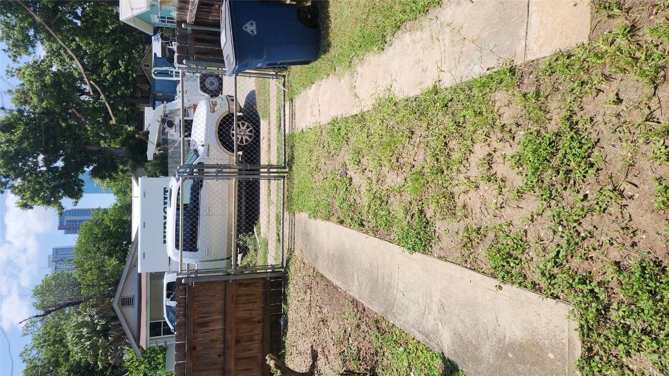85 Navasota Street Austin, TX 78702 - Photo 8 of 17 Fenced yard featuring a gate