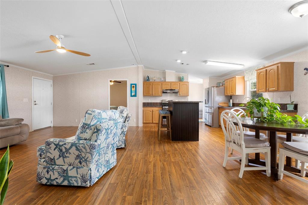 4393 Maple Avenue Edgewater, FL 32141 - Photo 11 of 41 a living room with furniture and kitchen view