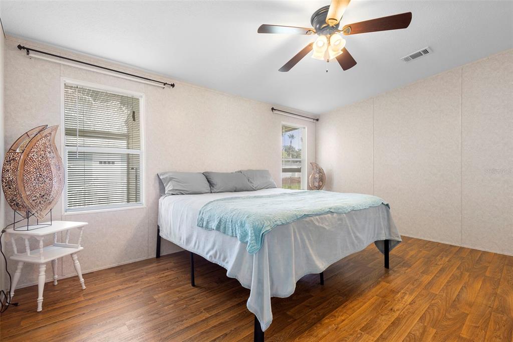 4393 Maple Avenue Edgewater, FL 32141 - Photo 16 of 41 a bedroom with a bed and a window