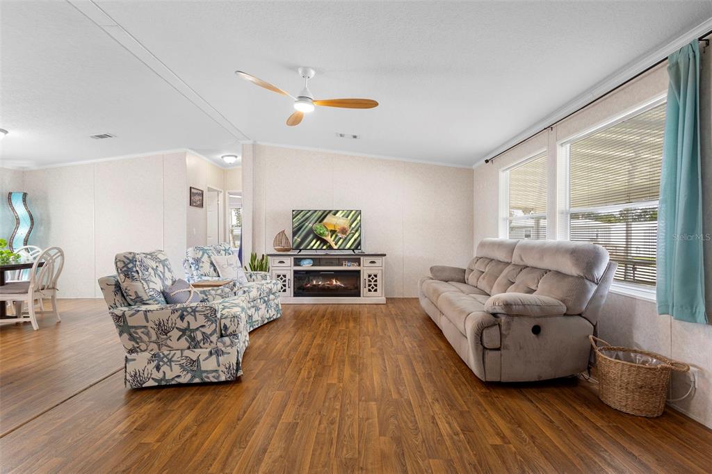 4393 Maple Avenue Edgewater, FL 32141 - Photo 2 of 41 a living room with furniture and a wooden floor