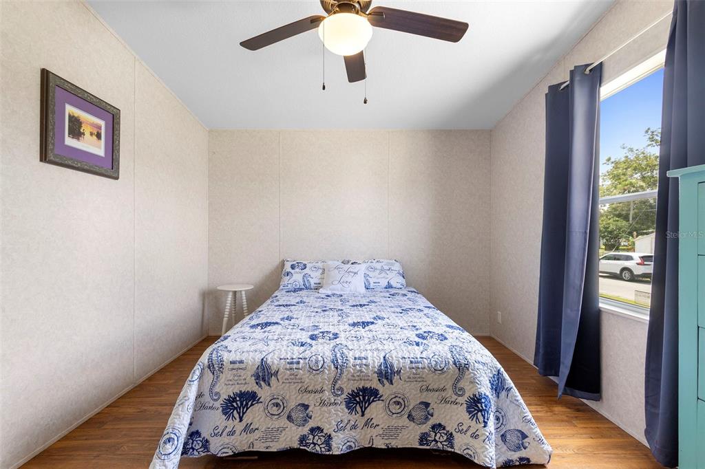 4393 Maple Avenue Edgewater, FL 32141 - Photo 21 of 41 a bedroom with a bed and a window