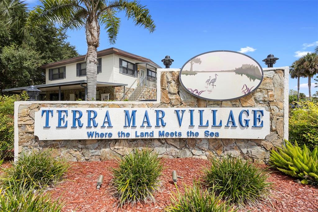 4393 Maple Avenue Edgewater, FL 32141 - Photo 29 of 41 a view of sign board with potted plants and wooden fence