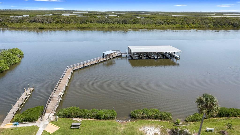 4393 Maple Avenue Edgewater, FL 32141 - Photo 30 of 41 a view of a lake with a mountain in the background