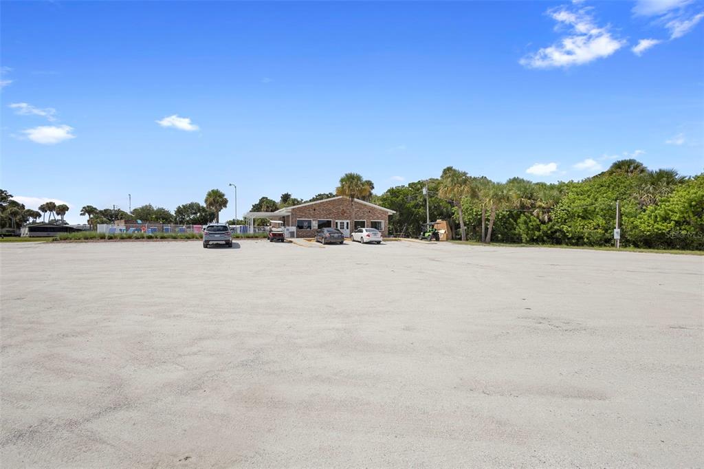 4393 Maple Avenue Edgewater, FL 32141 - Photo 35 of 41 a view of a house with a yard and lake view