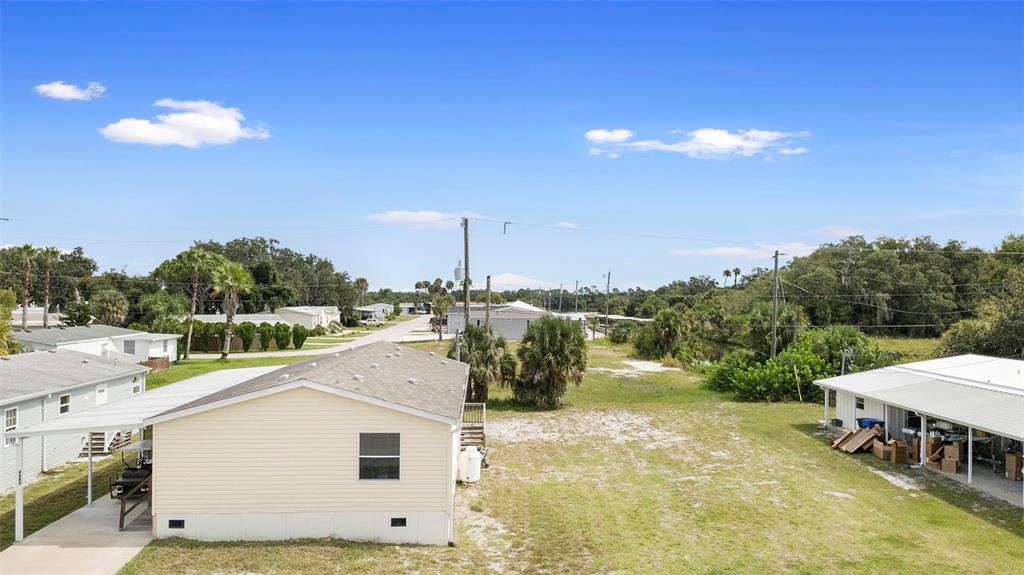 4393 Maple Avenue Edgewater, FL 32141 - Photo 36 of 41 a view of a terrace with a yard