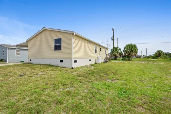 a view of a backyard of the house
