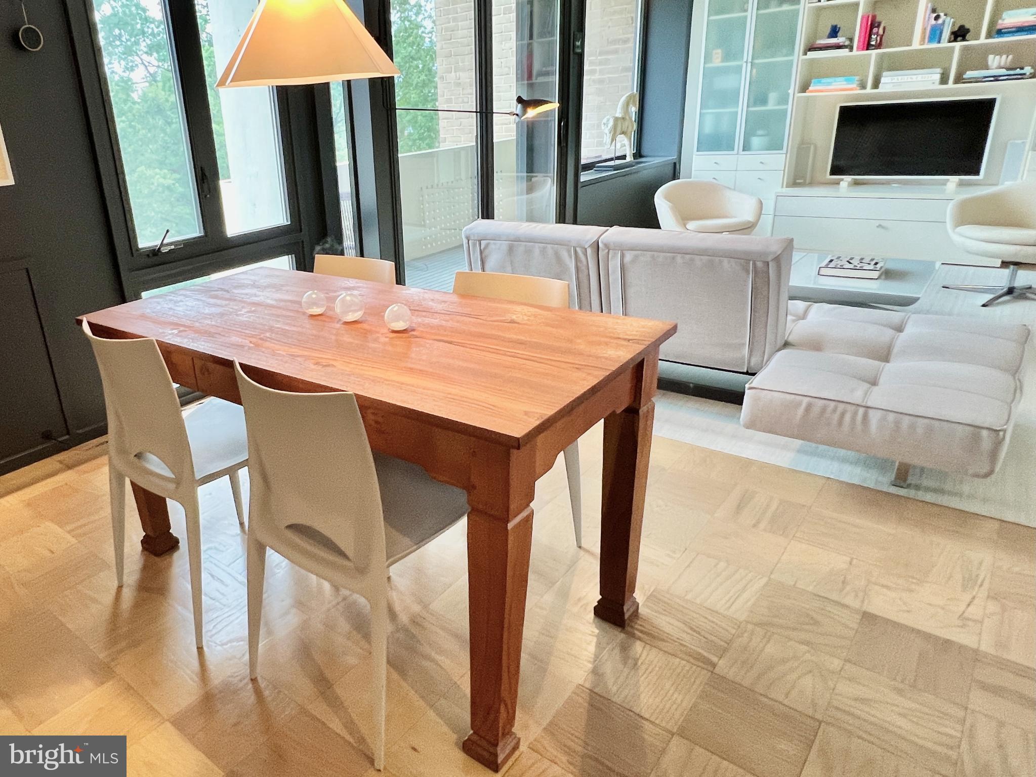 429 N Street Southwest, Unit S510 Washington, DC 20024 - Photo 11 of 45 a view of a dining room with furniture and wooden floor