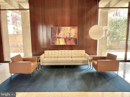 a swimming pool with outdoor seating