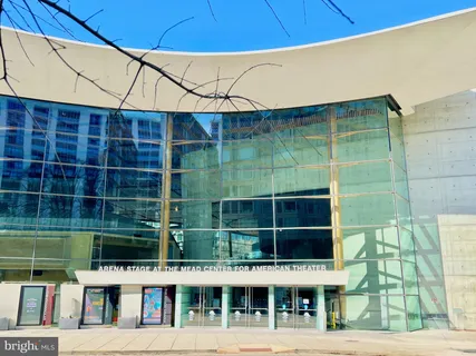 a front view of a building with glass windows and door