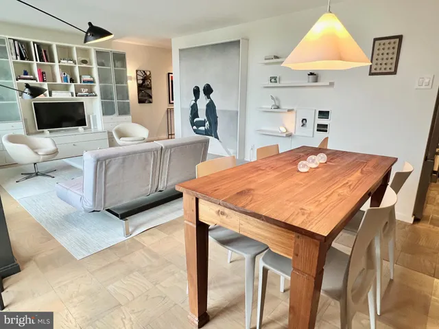 a dining room with a table and chairs