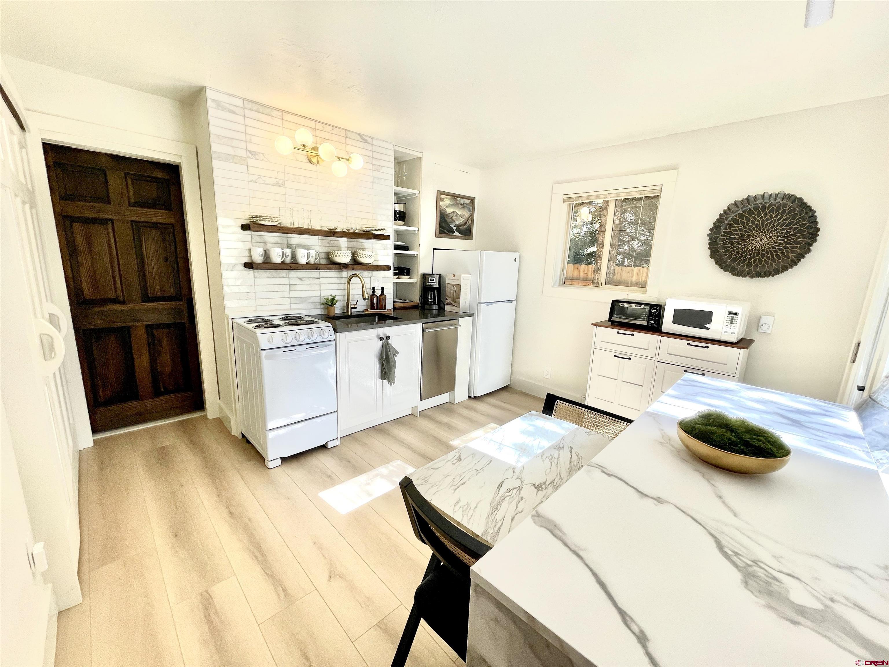 170 Lower Allen Road Crested Butte, CO 81224 - Photo 26 of 42 a kitchen with a stove a refrigerator and a sink