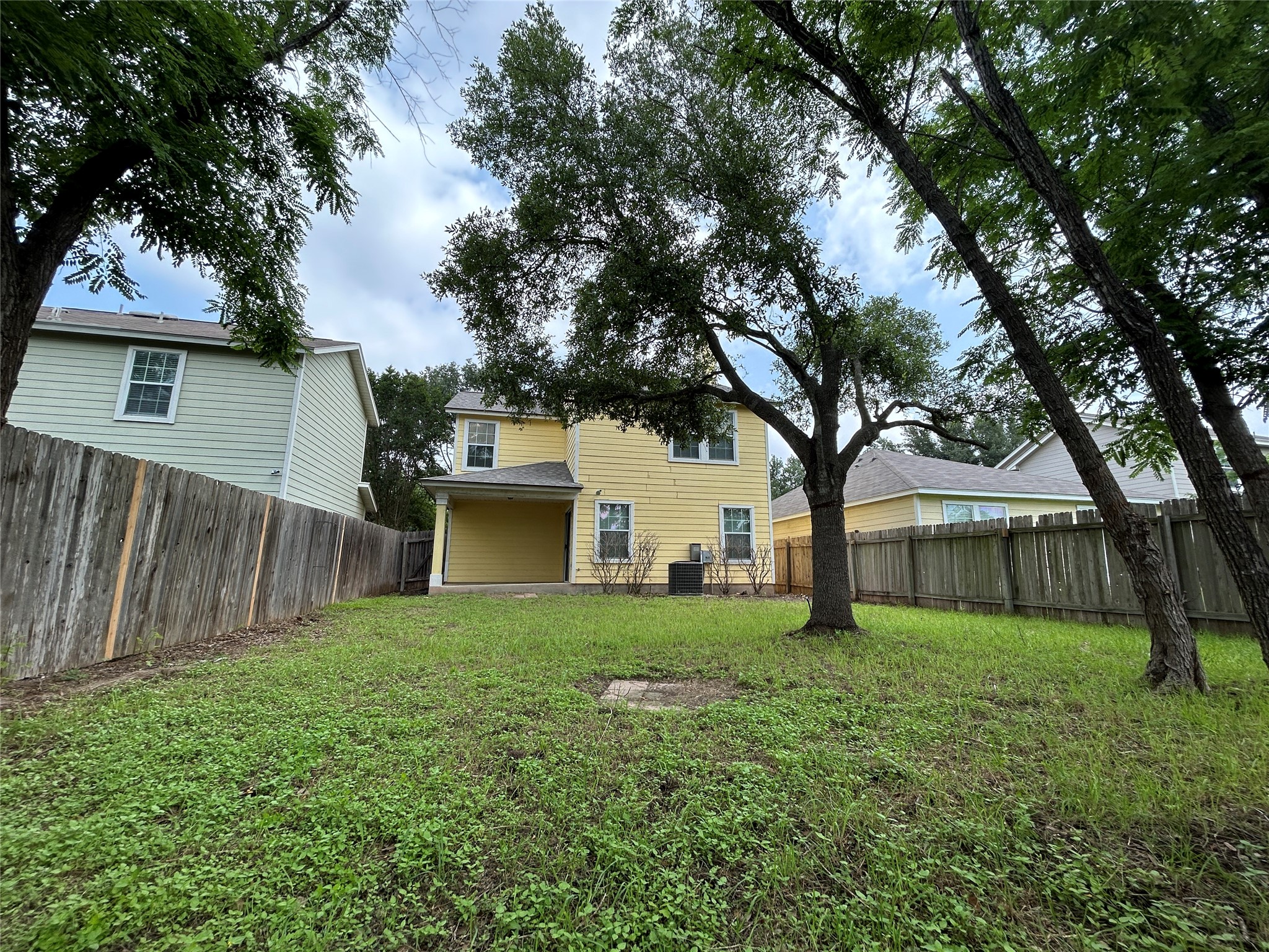 1909 Tranquilo Trail Austin, TX 78744 - Photo 14 of 14 enjoy this shaded and private backyard