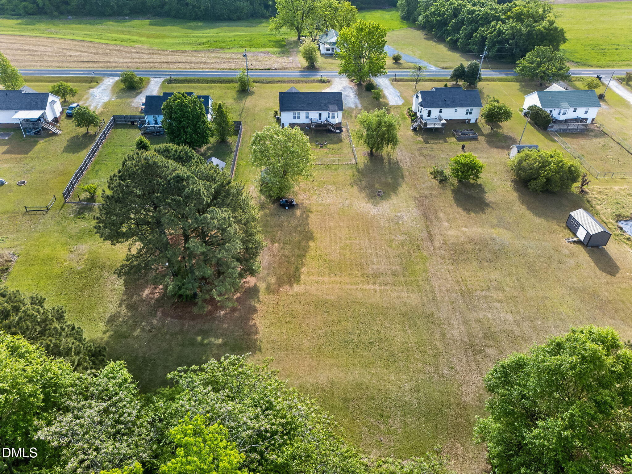 1101 Live Oak Road Coats, NC 27521 - Photo 26 of 29 a view of a lake with a building
