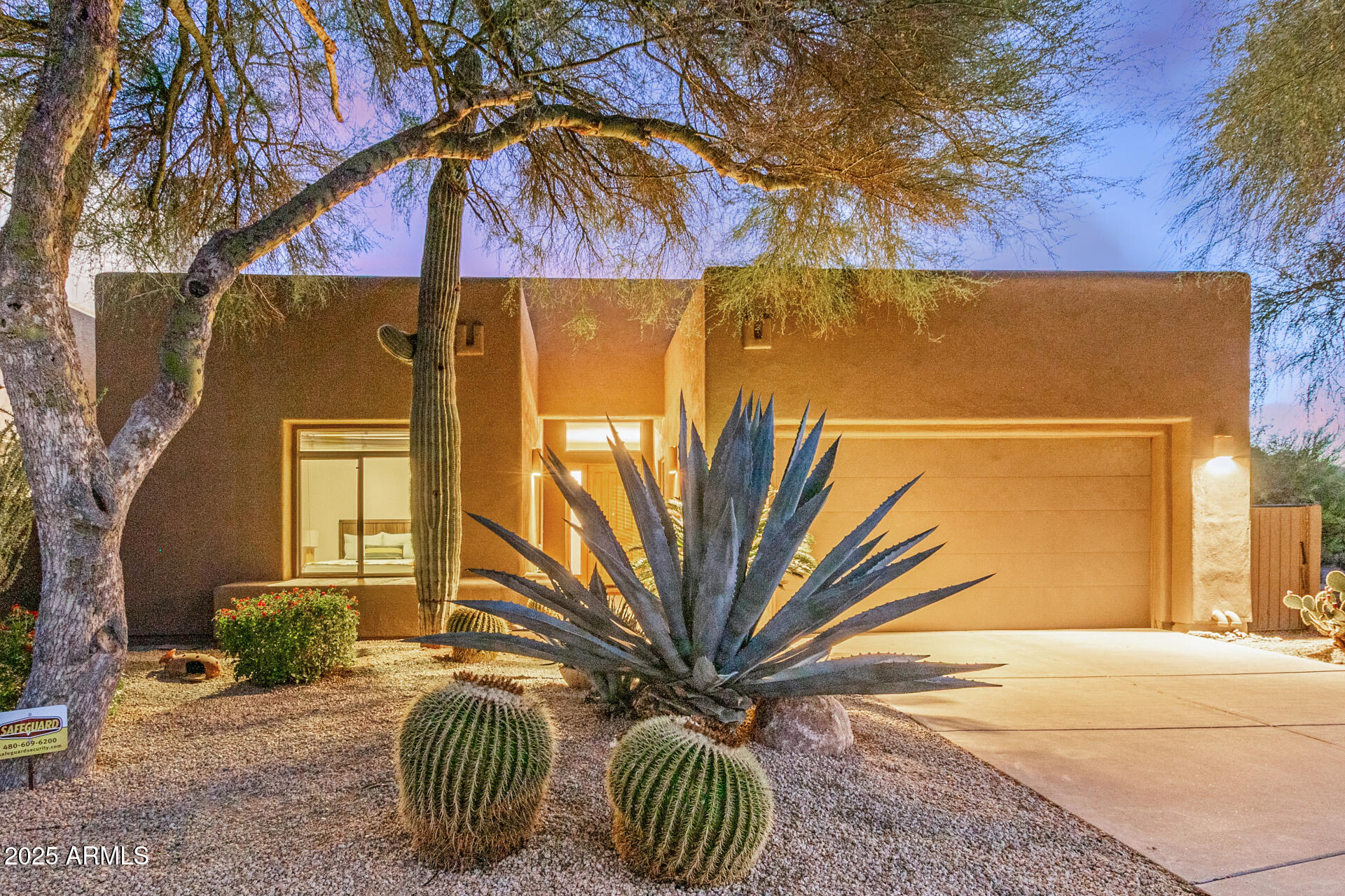a view of a house with a yard and furniture