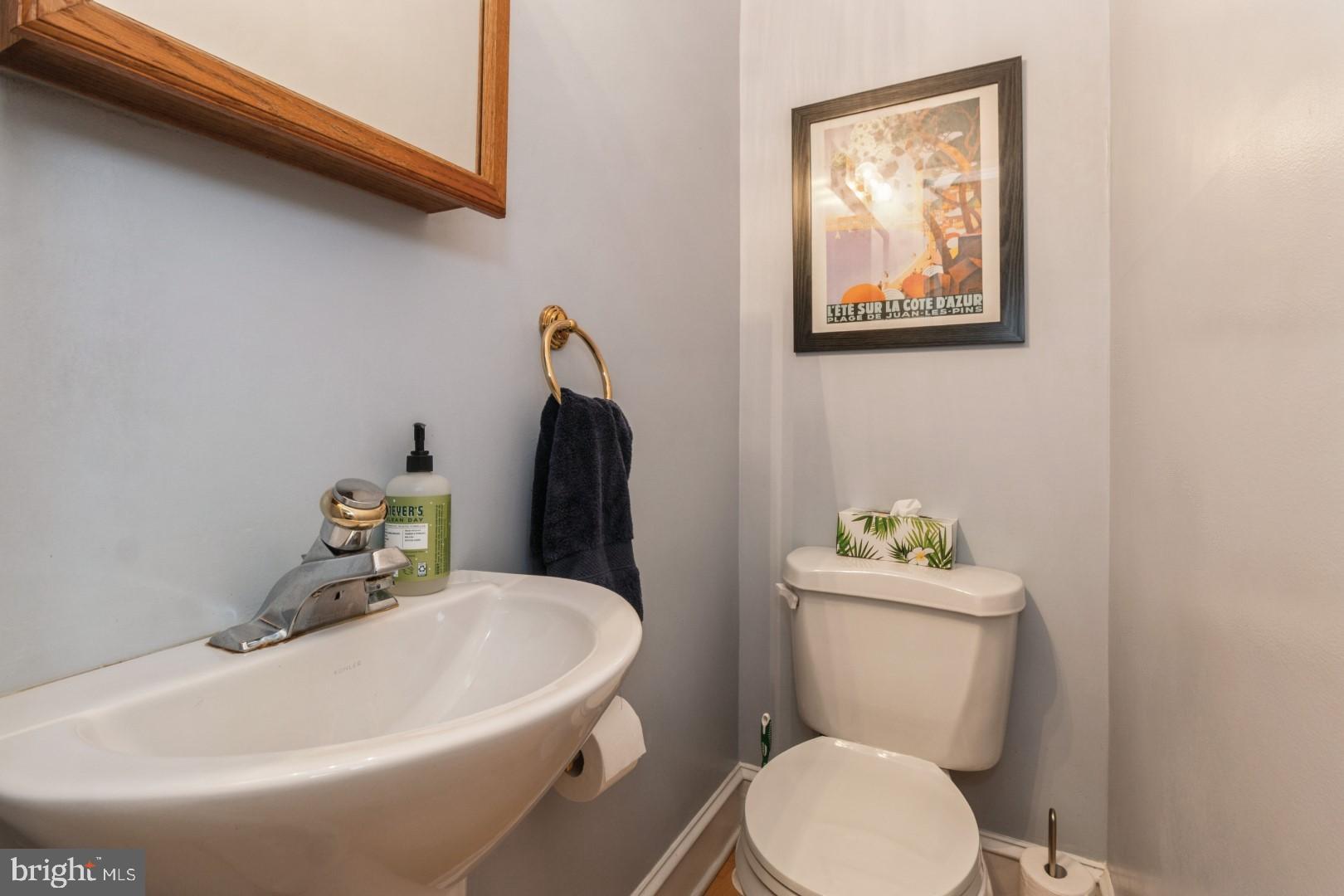 400 Maple Avenue Haddonfield, NJ 08033 - Photo 12 of 31 a white toilet sitting next to a bathroom sink